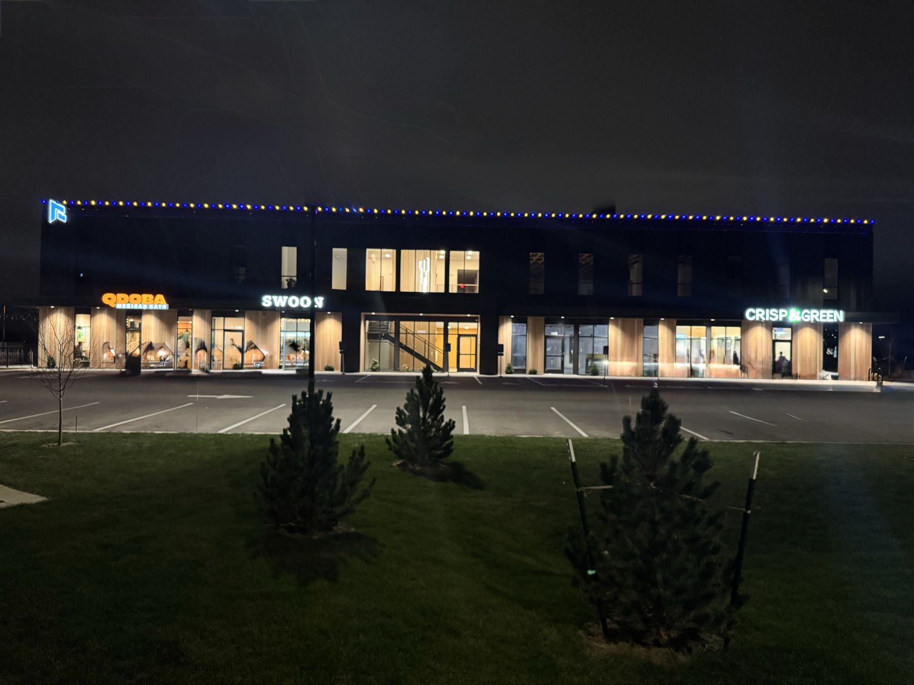 Commercial building with lights along the roofline